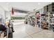 Spacious garage featuring overhead door, high ceilings, and ample storage at 126 Goat Trl, China Grove, NC 28023