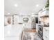 Bright, modern kitchen featuring white cabinets, stainless steel appliances, and stylish fixtures and a spacious island at 126 Goat Trl, China Grove, NC 28023