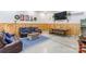 Spacious living area with wood paneling, comfortable seating, and a large screen television at 126 Goat Trl, China Grove, NC 28023