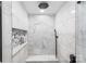Luxurious walk-in shower featuring marble tiles, a rainfall shower head, and a built-in niche for toiletries at 126 Goat Trl, China Grove, NC 28023