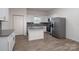 Updated kitchen features a center island, stainless appliances, and a stylish backsplash at 1305 Price Ave, Kannapolis, NC 28081
