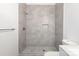 Modern bathroom shower featuring gray tile, a built-in niche, and sleek fixtures at 1305 Price Ave, Kannapolis, NC 28081