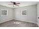 This bedroom features gray walls, wood-look floors, two windows, base molding and ample light at 132 Shady Grove Rd, Kings Mountain, NC 28086