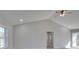Spacious room with vaulted ceiling, ceiling fan, neutral walls, and a view from the window at 132 Shady Grove Rd, Kings Mountain, NC 28086
