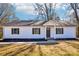 Charming single-story home featuring white siding, a dark roof, and well-maintained front yard landscaping at 132 Shady Grove Rd, Kings Mountain, NC 28086