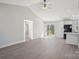 Open-concept living room with vaulted ceiling, recessed lighting, and sliding door access to a deck at 132 Shady Grove Rd, Kings Mountain, NC 28086
