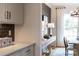 Dining room and dry bar area with lots of natural light, perfect for gatherings at 13943 Penbury Ln # 376, Charlotte, NC 28278
