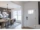 Elegant dining room featuring modern chandelier, stylish decor, and an adjacent living space at 13943 Penbury Ln # 376, Charlotte, NC 28278