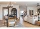 Open concept living space with a dining area, staircase, and comfortable seating arrangement at 13943 Penbury Ln # 376, Charlotte, NC 28278