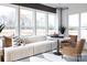 Bright sunroom with large windows, a comfortable sofa, and stylish decor that looks out over a beautiful yard at 13943 Penbury Ln # 376, Charlotte, NC 28278