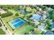 An aerial view showcases community amenities including the pool, tennis courts, and a scenic pond at 15124 Hugh Mcauley Rd, Huntersville, NC 28078