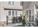 Back deck featuring outdoor furniture, a retractable awning, a grill, and stairs down to the backyard and patio at 15124 Hugh Mcauley Rd, Huntersville, NC 28078
