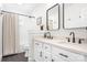 Modern bathroom features a double vanity, sleek black fixtures, and a tiled shower at 15124 Hugh Mcauley Rd, Huntersville, NC 28078