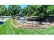 Picturesque community waterfall feature with vibrant flowers and greenery at 15124 Hugh Mcauley Rd, Huntersville, NC 28078