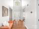 Spacious foyer with hardwood floors, high ceilings, and a decorative sitting bench at 15124 Hugh Mcauley Rd, Huntersville, NC 28078