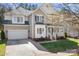 Charming two-story home with a welcoming front porch and attached two car garage at 15124 Hugh Mcauley Rd, Huntersville, NC 28078