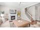 Comfortable living area with fireplace, TV, and view of the staircase at 15124 Hugh Mcauley Rd, Huntersville, NC 28078