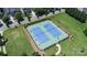 Community tennis courts surrounded by lush landscaping and mature trees at 15124 Hugh Mcauley Rd, Huntersville, NC 28078