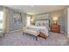 Serene main bedroom features neutral tones, soft lighting, and stylish decor at 15311 Lake Ridge Rd, Charlotte, NC 28278