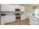 Bright kitchen featuring modern cabinets, stainless steel appliances, and an open layout at 15311 Lake Ridge Rd, Charlotte, NC 28278