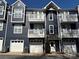 Charming townhouse exterior with attached garages, upper balconies, and modern curb appeal at 1634 Walnut View Dr, Charlotte, NC 28208