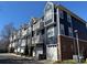 Beautiful townhome row showcasing private balconies and attached garages at 1634 Walnut View Dr, Charlotte, NC 28208