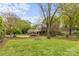 A large backyard with lush lawn, providing a versatile space for outdoor enjoyment and relaxation at 1644 Morningside Dr, Charlotte, NC 28205