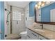 Modern bathroom features tiled shower with glass door, granite-topped vanity, and decorative mirror at 1644 Morningside Dr, Charlotte, NC 28205