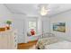 Bright bedroom featuring a window seat, hardwood floors, and ample closet space at 1644 Morningside Dr, Charlotte, NC 28205