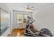 Bedroom featuring exercise equipment, light hardwood floors, and a sunny window at 1644 Morningside Dr, Charlotte, NC 28205