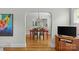 Dining area with hardwood floors and an open view into the kitchen at 1644 Morningside Dr, Charlotte, NC 28205
