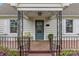 Inviting front porch with decorative iron railings and a cozy seating area at 1644 Morningside Dr, Charlotte, NC 28205