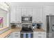 Modern kitchen offers stainless appliances, granite countertops, and ample cabinet space at 1644 Morningside Dr, Charlotte, NC 28205