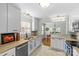 Well-lit kitchen featuring granite countertops, stainless steel appliances, and modern fixtures at 1644 Morningside Dr, Charlotte, NC 28205
