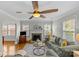 Spacious living room with neutral paint, hardwood floors, fireplace, and lots of natural light at 1644 Morningside Dr, Charlotte, NC 28205