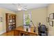 Office with a ceiling fan, desk, bookshelf, and window that provides plenty of natural light at 1644 Morningside Dr, Charlotte, NC 28205