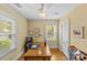 Bright office space features hardwood floors, neutral paint, and a ceiling fan at 1644 Morningside Dr, Charlotte, NC 28205