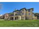 Large backyard with patio featuring spiral staircase to upper level at 16744 Ashton Oaks Dr, Charlotte, NC 28278
