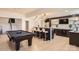 Basement bar and game area with a pool table, contemporary lighting, and modern decor at 16744 Ashton Oaks Dr, Charlotte, NC 28278