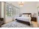 Bright bedroom featuring plush carpet, natural light, and neutral decor at 16744 Ashton Oaks Dr, Charlotte, NC 28278