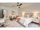 Bright bedroom features neutral tones, sitting area, and a large bed with plush pillows at 16744 Ashton Oaks Dr, Charlotte, NC 28278