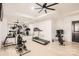 Bright exercise room with treadmill, elliptical, stationary bike and large mirror at 16744 Ashton Oaks Dr, Charlotte, NC 28278