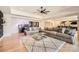 Spacious living room featuring a large sectional sofa, a stylish area rug, and elegant design at 16744 Ashton Oaks Dr, Charlotte, NC 28278