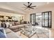 Open-concept living room with access to outdoor patio, featuring comfortable seating and stylish decor at 16744 Ashton Oaks Dr, Charlotte, NC 28278