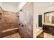 This walk in shower features stone tile and a built in bench at 16744 Ashton Oaks Dr, Charlotte, NC 28278