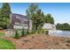 Welcome to Palisades sign surrounded by greenery and a serene water feature, creating an inviting entrance at 16744 Ashton Oaks Dr, Charlotte, NC 28278