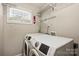 Well-lit laundry area with modern appliances, providing convenience and functionality at 1837 Academy St, Charlotte, NC 28205