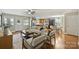 Open concept living area features hardwood floors, modern decor, and a seamless flow to the kitchen at 1837 Academy St, Charlotte, NC 28205