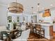 Bright open floor plan with modern kitchen, island with bar seating and view to the living room at 19728-B School St, Cornelius, NC 28031