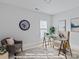 Home office with natural light and a decorative clock on the wall at 19728-B School St, Cornelius, NC 28031